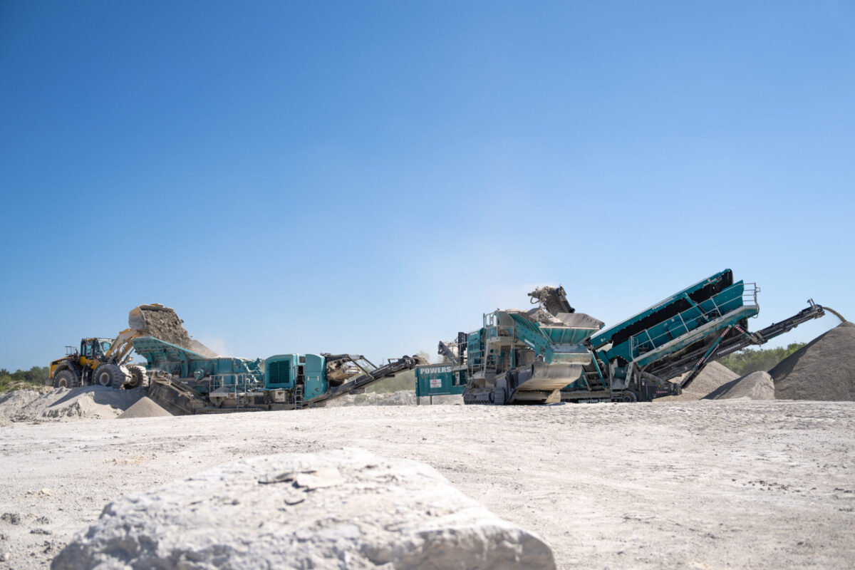 blue machine sprocessing rocks