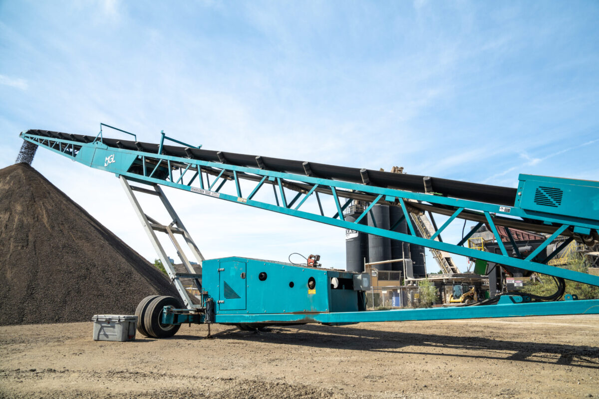 stacking conveyor moving material into a stockpile
